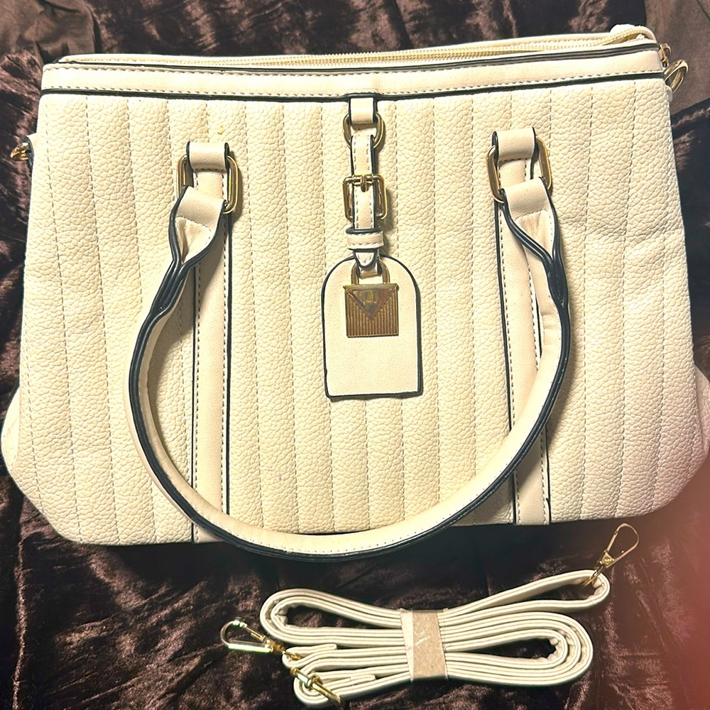 Vegan leather satchel cream color with 2 handles and cross body strap gold tone